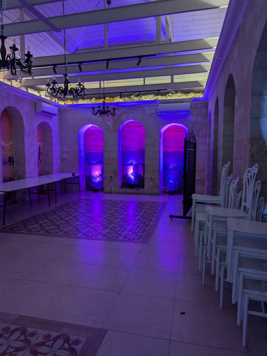 Event hall washed in purple uplighting