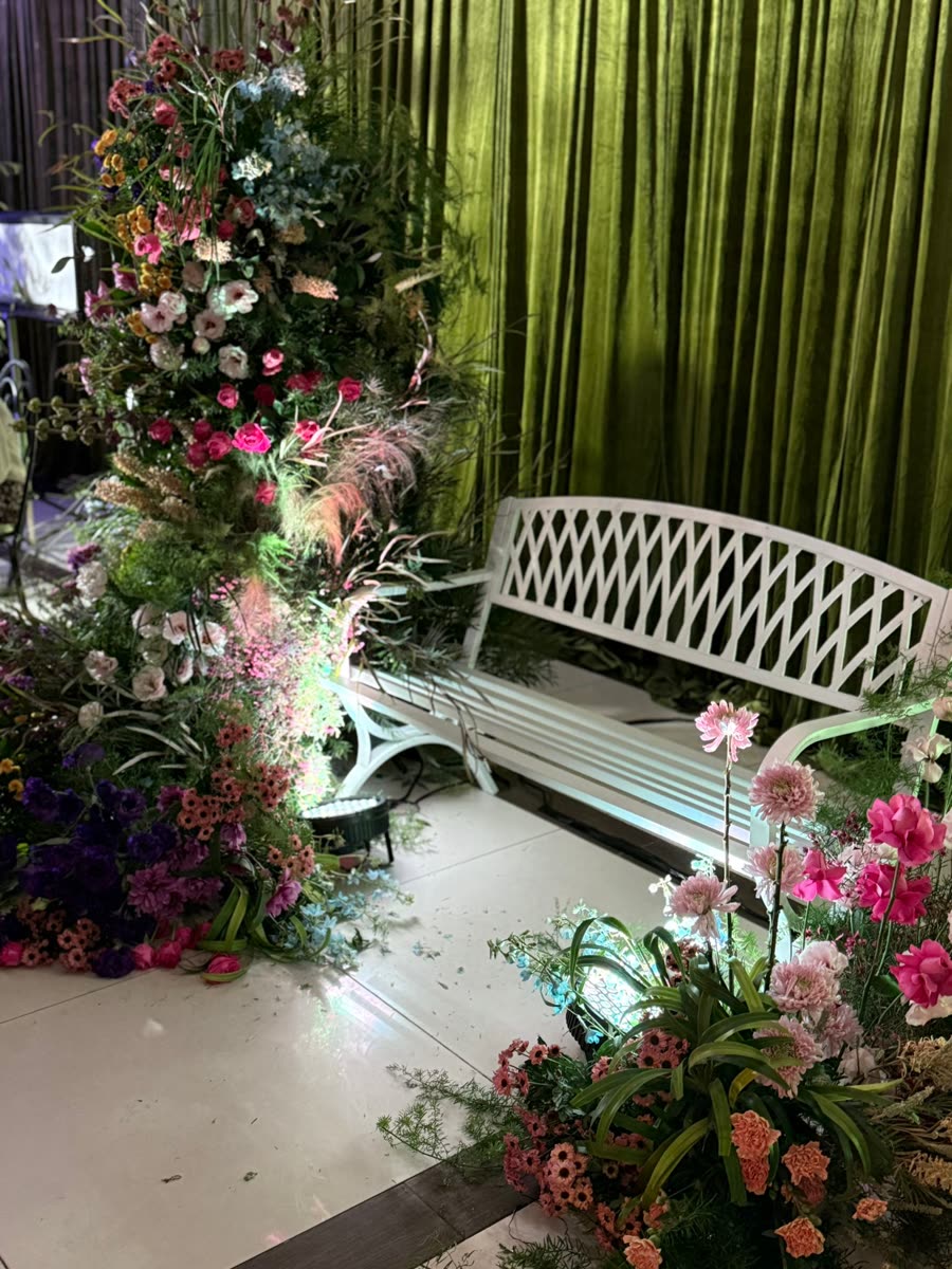 Garden-style décor and bench under warm lighting